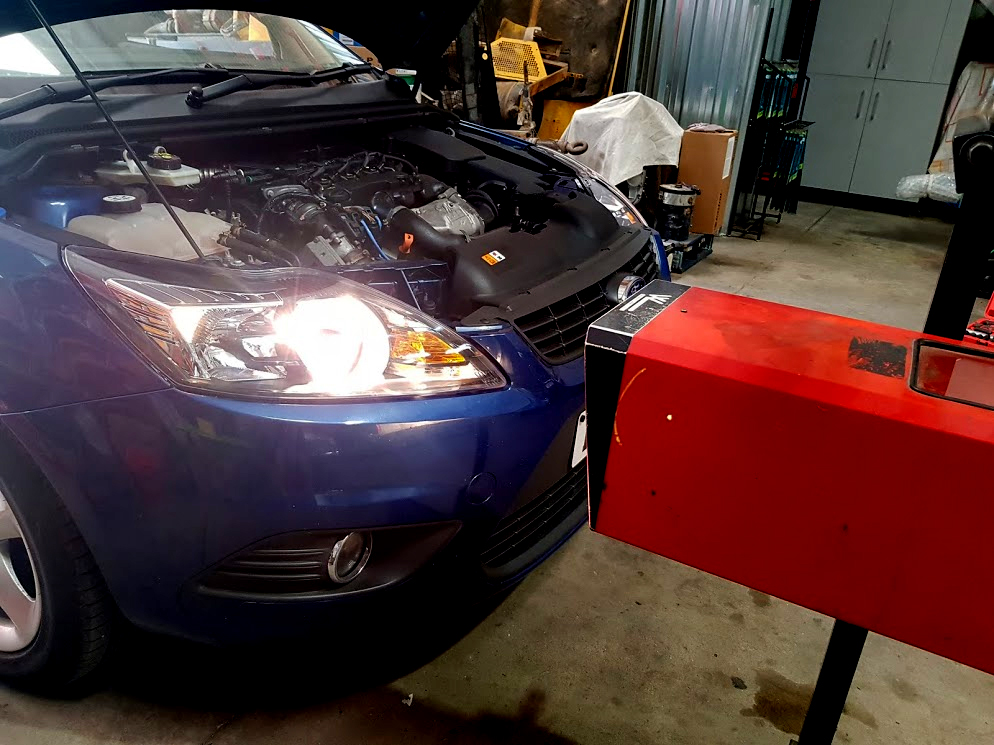 Headlights being checked and aligned for import test at our workshop Ford Focus Headlight Check